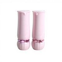 Matériaux d'emballage cosmétique en gros : Tubes de rouge à lèvres papillon rose, Tubes vides ronds pour onguents et rouges à lèvres, en stock.