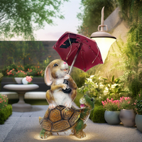 Statue de jardin solaire Lapin de Pâques extérieur, lapin assis sur une tortue, tenant un parapluie, avec guirlande lumineuse