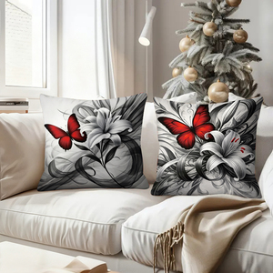 Des papillons rouges et des lys ornent des coussins décoratifs élégants noirs et blancs, ajoutant un charme festif au salon confortable. - Product Image 4