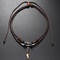 Collier ethnique en dent de loup, collier vintage tribal en cuir tressé avec perles, accessoire de chaîne de cou, pendentif multi-couches en dent de loup, bijoux cadeaux