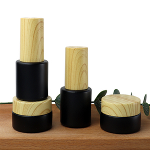 Tarros de vidrio personalizados con acabado mate esmerilado negro de 50g, 30g, 15g, 10g, <span class=keywords><strong>5g</strong></span>, 10ml, 20ml, 50ml con tapas de bambú con textura de madera. - Product Image 2