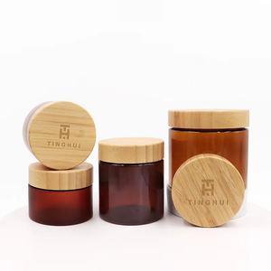 Meilleures ventes : Pots en verre ambré marron pour cosmétiques et produits pour animaux de compagnie, avec couvercle en bois de bambou, pour beurre corporel et gommages, disponibles en 50g, 150g, 250g, 500g et 8 oz. - Product Image 1