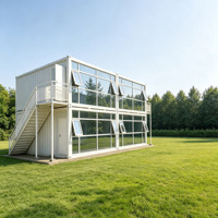 Villa préfabriquée de luxe sur mesure à deux étages, maison modulaire moderne avec mur-rideau en verre et escalier