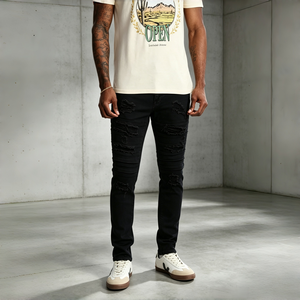 Pantalon en jean slim noir uni extensible et élégant avec déchirures superposées et effilochées pour un look streetwear urbain branché - Product Image 1