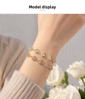 Nouveauté transfrontalière : Bracelet trèfle à quatre feuilles, design élégant et avant-gardiste, entièrement pavé de zircons, haute qualité
