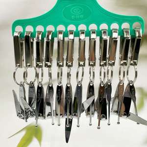 Ensemble de coupe-ongles multifonctionnel portable avec porte-clés, pendentif clé, outils de soin des ongles pour la maison, articles de vendeur ambulant à 2 yuans. - Product Image 4
