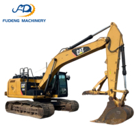 Excavatrice sur chenilles CAT 320GC d'occasion bien entretenue, 20 tonnes, avec godet de 1,1 m³ pour les travaux de pose de canalisations en construction urbaine