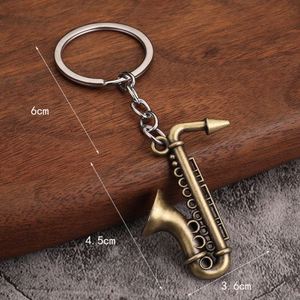 Venta al por Mayor de Instrumentos Musicales Creativos, Colgantes Circulares, Regalos Musicales, Juguetes, Llaveros Metálicos Miniatura de Saxofón - Product Image 2