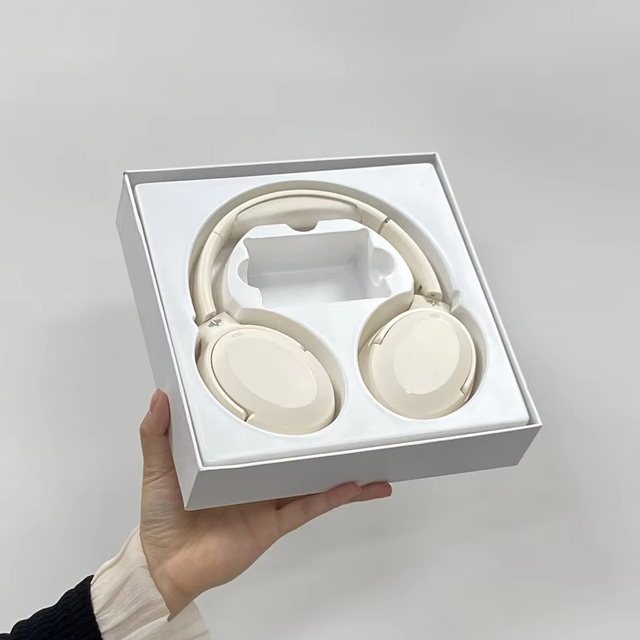 Custom White Bluetooth Wireless Earbuds Headset Packaging Box with Sponge Lining Embossed Printing Unique Earphone Design