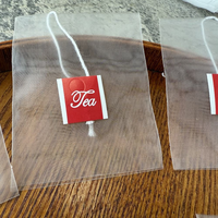 Meilleur prix, qualité alimentaire, logo personnalisé, sachet de thé en nylon thermoscellable de haute qualité avec cordon pour l'emballage des feuilles de thé