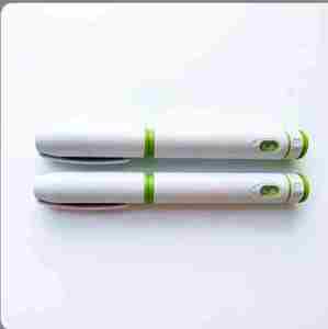 Stylo jetable 10mg avec petite fenêtre, design vert et blanc - Product Image 5