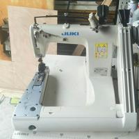 Machine à coudre industrielle à double aiguilles à point de chaînette Juki-1190M 1261 à alimentation par le bras, en bon état d'occasion