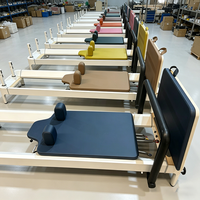 Lit de Pilates compact et pliable en aluminium blanc durable pour la remise en forme à domicile et en studio