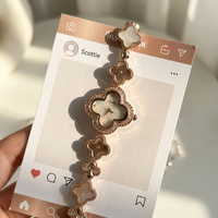 Montre Scottie 9695 haut de gamme au design unique trèfle à quatre feuilles pour femme, idéale pour les tenues de mode, la photographie et les voyages, en acier inoxydable exclusif