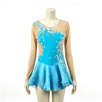Robe de patinage artistique turquoise à manches longues avec côtés en maille et jupe ornée de strass pour filles et adultes, idéale pour la compétition et les spectacles