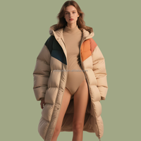 Manteau matelassé pour femme en duvet de canard blanc 90% ODM, avec blocs de couleur personnalisés OEM, long, à capuche, pour l'hiver, de créateur, fabrication usine