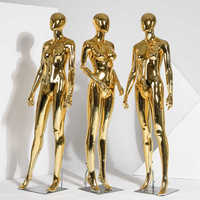 Maniquí de cuerpo completo de material dorado brillante para lencería, con cabeza de huevo, de pie y autónomo.
