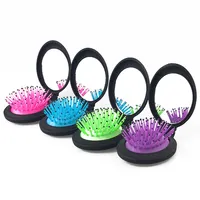 Erstaunliche Qualität Mini-Haar bürste mit Spiegel Andere Haarstyling-Werkzeuge Clamshell-Airbag Klapp kamm