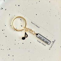 1 pièce Porte-clés tendance et personnalisé avec motifs notes de musique, touches de piano et combinaisons de violon