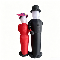 Squelette gonflable de couple du Jour des Morts en tenue formelle noire et rouge avec panneau de message pour décoration lumineuse de fête