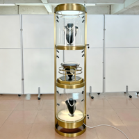 Vitrine rotative ronde en métal doré pour bijoux, présentoir en verre verrouillable à 3 niveaux avec éclairage LED pour la vente au détail de bijoux et de montres