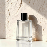Flacon de parfum carré minimaliste en verre transparent 50ml 100ml rechargeable avec pulvérisateur à pompe et capuchon noir, parfum neutre, sérigraphié