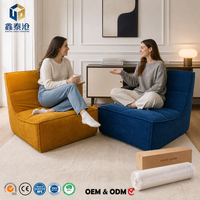 Fauteuil lounge moderne bleu sans accoudoirs, structure entièrement en mousse compressée sous vide, canapé une place en boîte pour salon et chambre