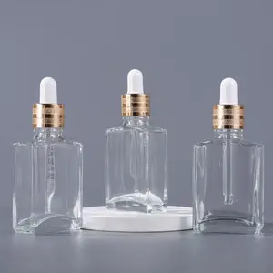 Bottiglie contagocce rettangolari da 30ml in vetro trasparente quadrato coperchio in alluminio bottiglia di siero glassata Design fantasia per cosmetici con pipetta