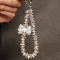 Lanière de téléphone portable avec nœud en perles et strass brillants, chaîne anti-chute, pendentif clé tendance pour femme, petit cadeau à la mode