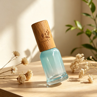 Bouteille d'emballage en verre aromatique bleu dégradé avec bouchon en bois de hêtre