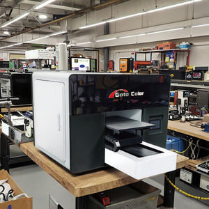 Impresora UV de cama plana A3 de alta resolución 1200 ppp Max CMYK + W + V fabricada en China - Product Image 1