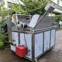 Friteuse à gaz électrique automatique pour mélanger et décharger les pois de cacahuètes Friteuse à frites et chips de pommes de terre