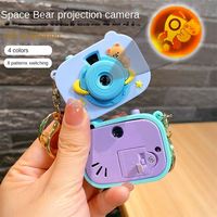Porte-clés projecteur kaléidoscope en forme d'ours spatial surprise avec bouton interrupteur et boucle pour appareil photo, petit pendentif mignon, vente en gros