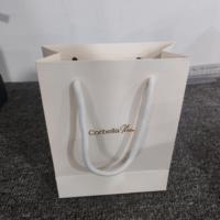 Sac cadeau en papier recyclé de qualité supérieure blanc personnalisé avec impression de logo pour les marques de mode