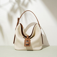 Sac seau bandoulière en cuir véritable haut de gamme pour femme 2026, grande capacité, style décontracté, avec rabat et design imperméable