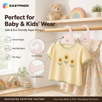 Cintres en carton enduit rose pastel certifiés écologiques pour vêtements d'enfants, vente en gros pour présentation en magasin