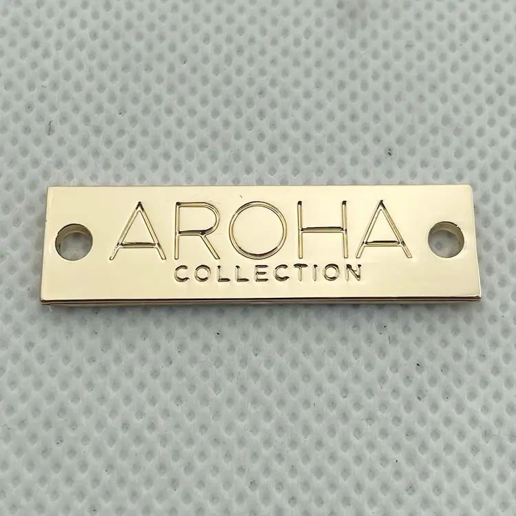 Neostar Wholesale cheap price gold stamping customized letters logo metal tag for clothing