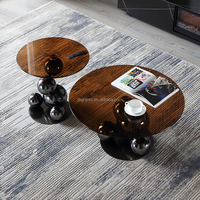 Table basse combinée en verre trempé rond avec base en acier inoxydable noir, style moderne et luxueux pour salon ou hôtel
