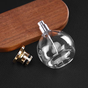 Flacon pulvérisateur de parfum en verre rond transparent haut de gamme de 100 ml, rechargeable, avec bouchon en alliage de zinc doré ou argenté - Product Image 5