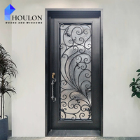 Porte d'entrée de luxe en fer forgé avec décorations artistiques, verre dépoli et sécurité renforcée pour villa