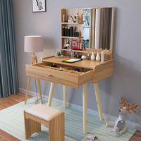 Table de toilette minimaliste moderne avec armoire de rangement, miroir rotatif, pieds en bois massif, petite table de maquillage pour chambre à coucher
