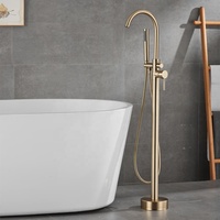 Robinet de baignoire autoportant en or brossé