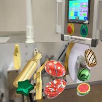 Équipement d'emballage sous film multi-formes pour confiseries variées, à fonctionnement rapide et personnalisable