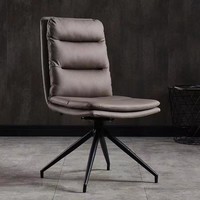 Chaise de salle à manger moderne nordique de luxe léger avec revêtement en cuir, structure pivotante en métal et panneau de fibres à densité moyenne pour la maison