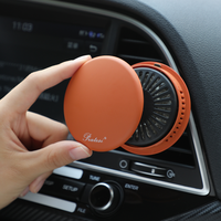 Diffuseur de parfum minimaliste rond pour grille d'aération de voiture, avec couvercle magnétique, rechargeable, désodorisant et aromathérapie automobile