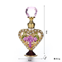 Flacon de parfum personnalisé de luxe en métal de 5ml du Moyen-Orient avec verre vide unique en forme de coeur Flacon d'essentiel flacons rechargeables