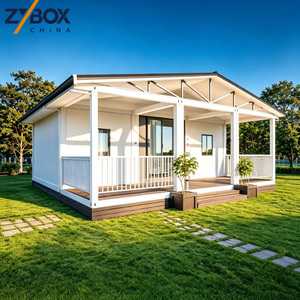 Maison conteneur extensible <span class=keywords><strong>de</strong></span> 40 pieds à toit à pignon, avec porche en treillis d'acier blanc et terrasse marron, Villa modulaire préfabriquée <span class=keywords><strong>de</strong></span> luxe AU - Product Image 1