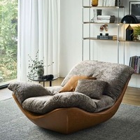 Fauteuil à bascule de salon design nordique, créatif, moderne et minimaliste, capitonné, haut de gamme pour appartement