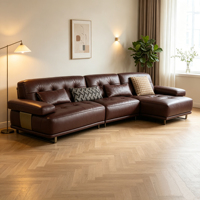 Canapé confortable en cuir véritable en forme de L, large et spacieux, avec rembourrage en éponge, idéal pour la détente familiale en villa et l'accueil des invités