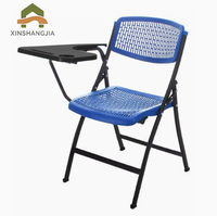 Chaise pliante d'école et de formation en plastique durable et respirant avec tablette, cadre en métal noir pour salle de classe universitaire et salle de formation